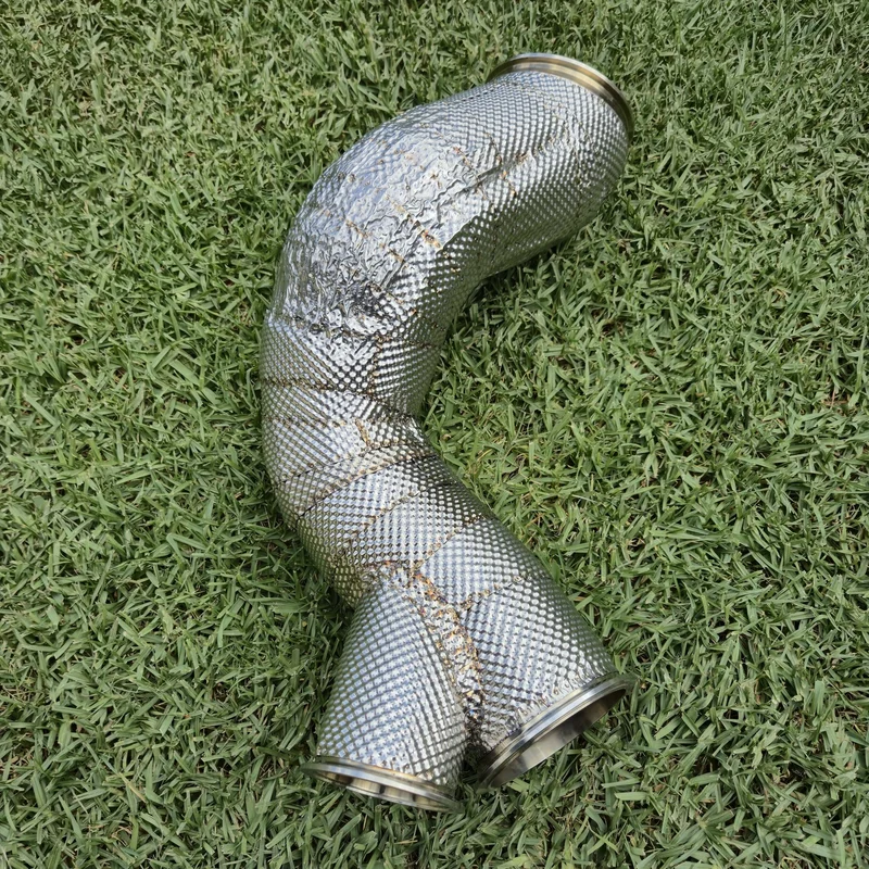 Top-down view of a professionally insulated exhaust Y-pipe with embossed stainless steel outer shell.